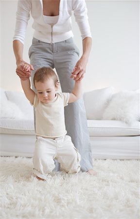 shag carpet - Baby Walking with Mother Stock Photo - Rights-Managed, Code: 700-00865702