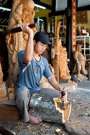 Woodcarver Working, Hoi An, Vietnam Stock Photo - Rights-Managed, Code: 700-00866477