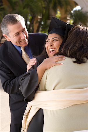 Parents diplômés s'enlaçant Photographie de stock - Rights-Managed, Code: 700-00897738