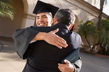 simsearch:700-00897808,k - Father Hugging Son at Graduation Ceremony Stock Photo - Rights-Managed, Code: 700-00897806