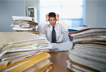 Businessman Surrounded By Paperwork Stock Photo - Rights-Managed, Code: 700-00909716