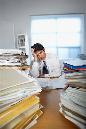 Businessman Surrounded By Paperwork Stock Photo - Rights-Managed, Code: 700-00909717