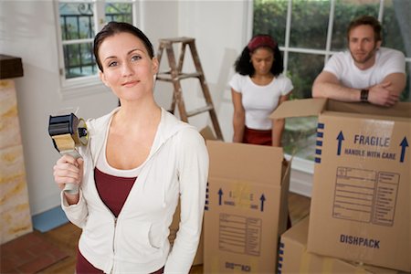 simsearch:700-01109929,k - People Packing Boxes In House Stock Photo - Rights-Managed, Code: 700-00918609