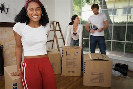 simsearch:700-01109929,k - People Packing Boxes In House Stock Photo - Rights-Managed, Code: 700-00918603