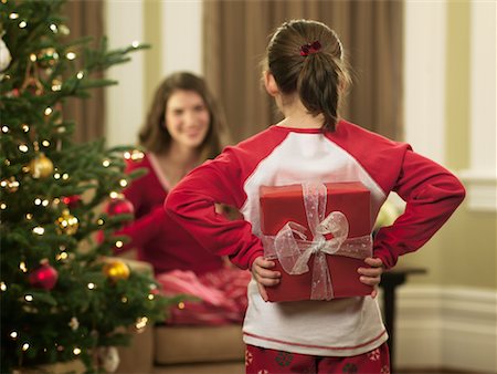 Girl Holding Present Behind Back Stock Photo - Rights-Managed, Code: 700-00911834