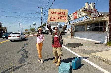 dead end sign - Couple Hitchhiking, Holding Sign On the Side of the Road Stock Photo - Rights-Managed, Code: 700-00934556