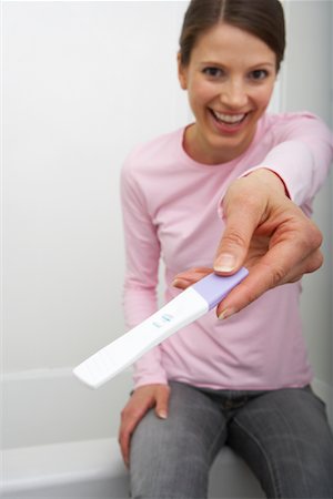 simsearch:600-01296088,k - Woman Holding Pregnancy Test Stock Photo - Rights-Managed, Code: 700-00935141