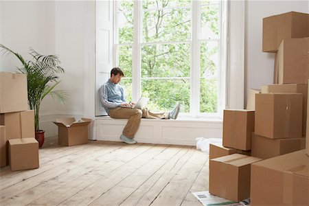simsearch:700-01109929,k - Man Using Laptop in Room Full of Boxes Stock Photo - Rights-Managed, Code: 700-00933785