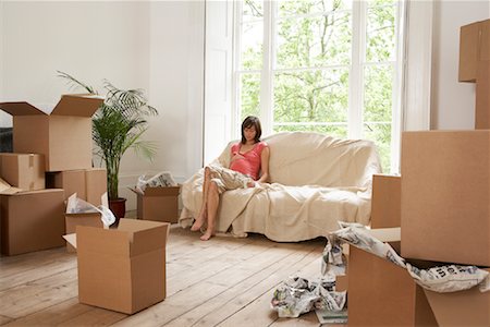 simsearch:700-01109929,k - Woman on Sofa in Room Full of Boxes Stock Photo - Rights-Managed, Code: 700-00933787