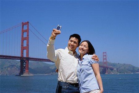 Couple Taking Self Portrait Near the Golden Gate Bridge, San Francisco, California, USA Stock Photo - Rights-Managed, Code: 700-00954928