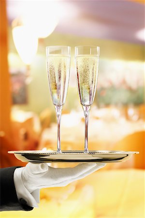 simsearch:600-01646509,k - Waiter Carrying Champagne on Tray Stock Photo - Rights-Managed, Code: 700-00955622