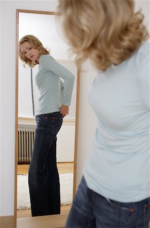 Woman Looking in Mirror Stock Photo - Rights-Managed, Code: 700-00984307