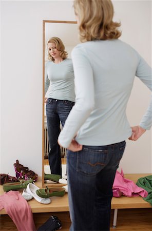 Woman Looking in Mirror Stock Photo - Rights-Managed, Code: 700-00984310