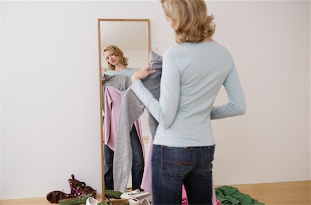 Woman Looking in Mirror Stock Photo - Rights-Managed, Code: 700-00984313
