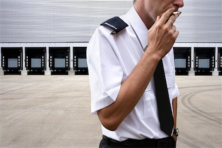 smoker (male) - Security Guard Smoking Cigarette Stock Photo - Rights-Managed, Code: 700-01000836