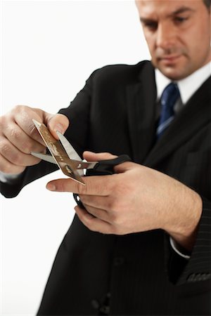 simsearch:700-01015007,k - Businessman Cutting Credit Card Stock Photo - Rights-Managed, Code: 700-01014983