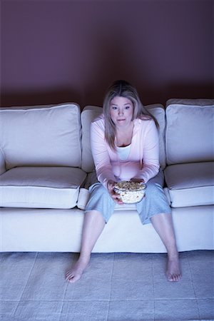 Woman with Popcorn Watching Television Stock Photo - Rights-Managed, Code: 700-01015052