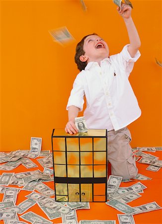 Boy Playing with Money Stock Photo - Rights-Managed, Code: 700-01015326