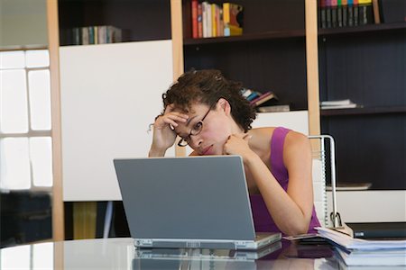 simsearch:700-00035269,k - Frustrated Woman Using Laptop Computer in Home Office Stock Photo - Rights-Managed, Code: 700-01015558