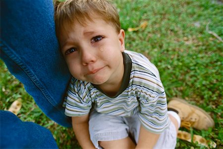 sulky tantrum - Boy Crying, Leaning on Person's Leg Stock Photo - Rights-Managed, Code: 700-01030225