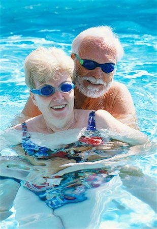 senior women swimming - Couple in Swimming Pool Stock Photo - Rights-Managed, Code: 700-01030229