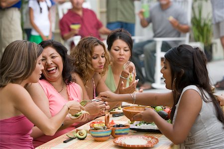 Women Preparing Food at Family Gathering Stock Photo - Rights-Managed, Code: 700-01041312