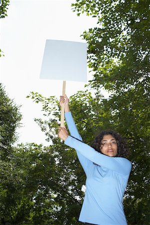 protester holding sign - Woman Holding Sign Stock Photo - Rights-Managed, Code: 700-01041323
