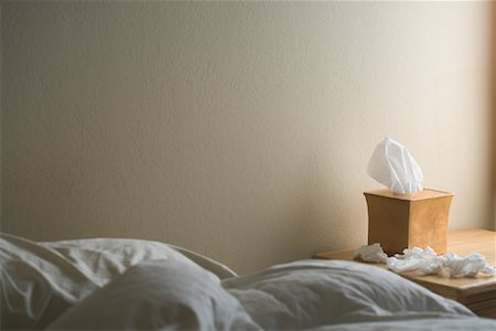 flu season - Box of Tissue next to Bed Stock Photo - Rights-Managed, Code: 700-01041369