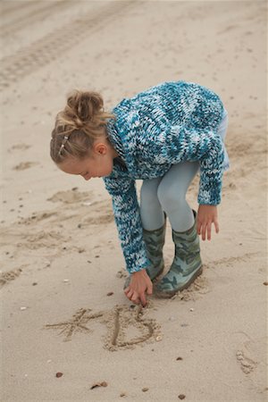 Girl Drawing in Sand Stock Photo - Rights-Managed, Code: 700-01042717