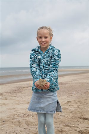 denim summer girl - Girl Playing with Sand on Beach Stock Photo - Rights-Managed, Code: 700-01042726