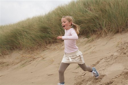 Girl Running Down Sand Dune Stock Photo - Rights-Managed, Code: 700-01042751