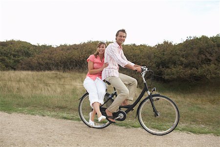 simsearch:700-00549929,k - Couple Riding Bicycle Together Stock Photo - Rights-Managed, Code: 700-01042799
