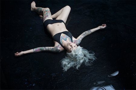 simsearch:700-00933633,k - Tattooed Woman Lying in Water Stock Photo - Rights-Managed, Code: 700-01043692