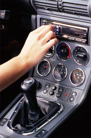 simsearch:700-01172393,k - Woman Adjusting Car Radio Stock Photo - Rights-Managed, Code: 700-01073037
