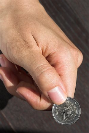 simsearch:700-02700162,k - Close-up of Woman's Hand Holding Coin Foto de stock - Con derechos protegidos, Código: 700-01083252