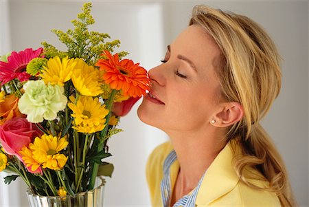 Woman Smelling Flower Bouquet Stock Photo - Rights-Managed, Code: 700-01083992