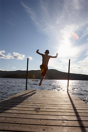 Jeune garçon plongeant dans le lac Photographie de stock - Rights-Managed, Code: 700-01099685