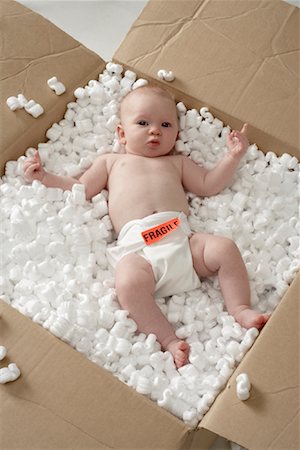 Baby in Cardboard Box Stock Photo - Rights-Managed, Code: 700-01099707