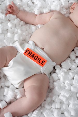 diaper for little girl - Baby in Cardboard Box Stock Photo - Rights-Managed, Code: 700-01099708