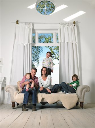 simsearch:700-02724695,k - Family Sitting in Living Room Stock Photo - Rights-Managed, Code: 700-01119896