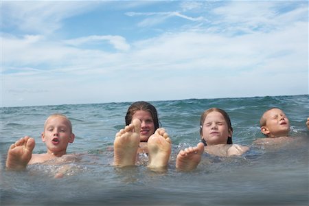 preteen girl floating on water - Children at the Beach, Barrie, Ontario, Canada Stock Photo - Rights-Managed, Code: 700-01110110