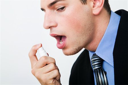 simsearch:700-00284729,k - Businessman Freshening Breath Stock Photo - Rights-Managed, Code: 700-01110587
