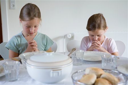 Sisters Praying before Meal Stock Photo - Rights-Managed, Code: 700-01111950