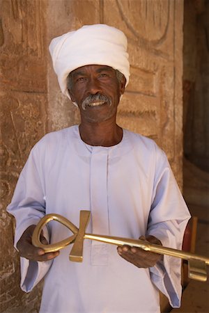 displays for gold photos - Man Holding Key of Life, Great Temple, Abu Simbel, Egypt, Africa Stock Photo - Rights-Managed, Code: 700-01112431