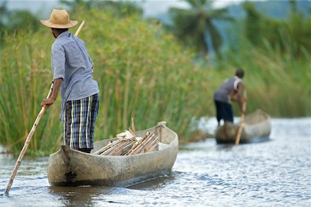 Men in Dugout Canoes on river, Antainambala River, Maroantsetra, Madagascar Stock Photo - Rights-Managed, Code: 700-01112693