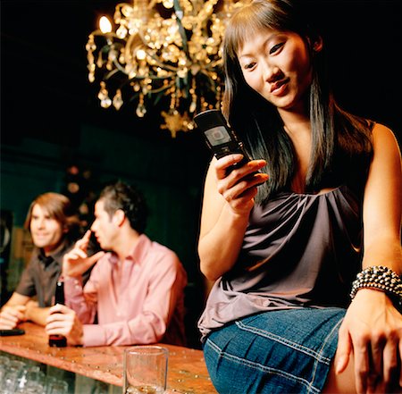 simsearch:700-00530291,k - Woman Using Cellular Phone in Bar Stock Photo - Rights-Managed, Code: 700-01164129