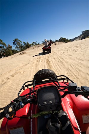 People Riding ATVs at Tangalooma Wild Dolphin Resort, Moreton Island, Queensland, Australia Foto de stock - Con derechos protegidos, Código: 700-01164935