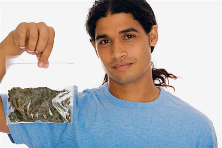 drugs (recreational) - Portrait of Man Holding Bag of Marijuana Stock Photo - Rights-Managed, Code: 700-01164958