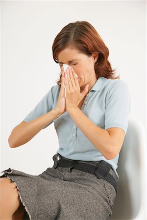 flu season - Woman Blowing Nose Stock Photo - Rights-Managed, Code: 700-01165191