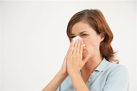 flu season - Woman Blowing Nose Stock Photo - Rights-Managed, Code: 700-01165192